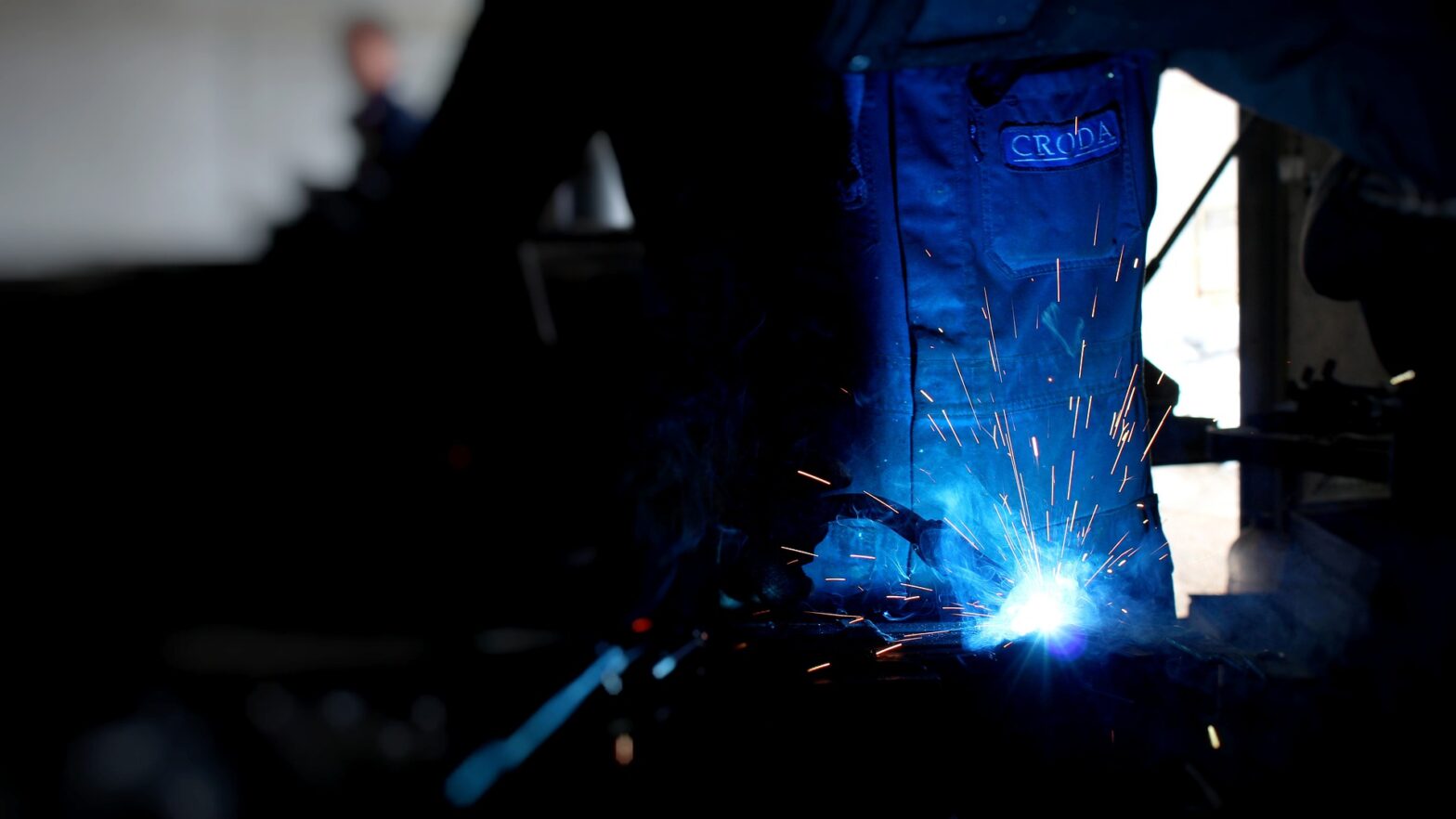 An image of someone welding